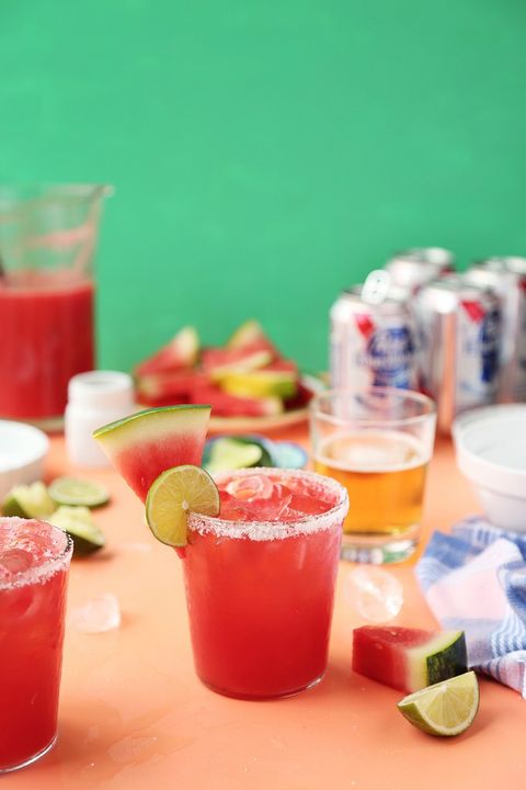 a pink watermelon margarita with a salted rim