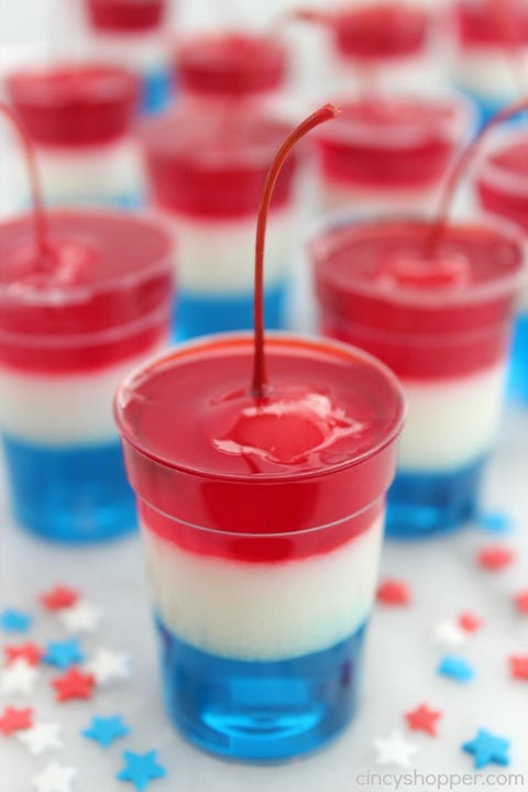 red white and blue jello cups with a cherry on top