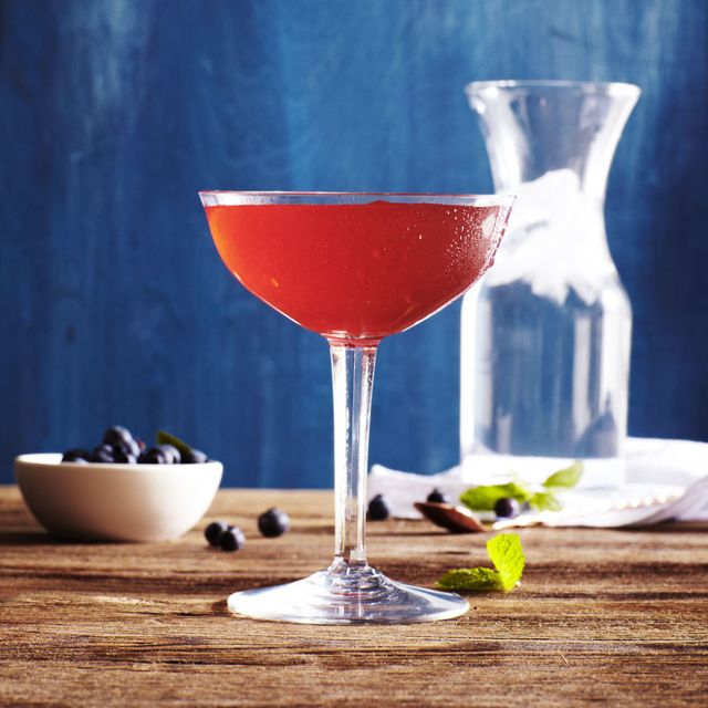 a red tall cocktail in a glass