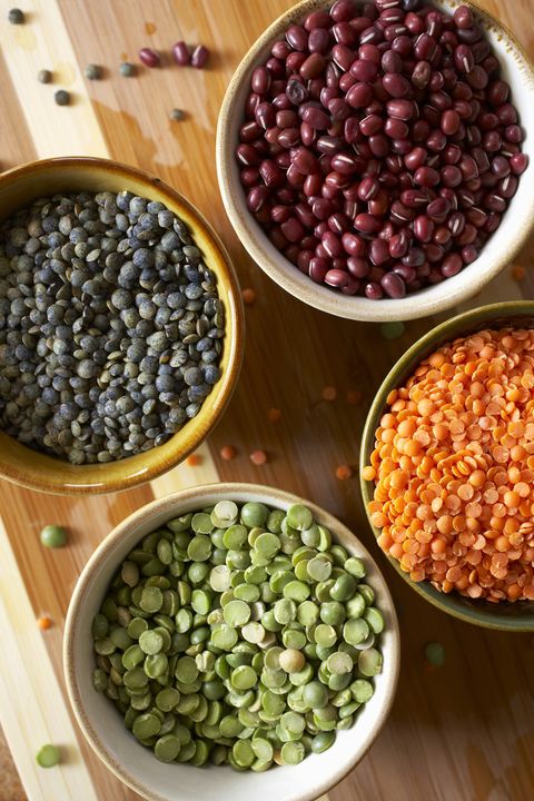 lentils, peas and beans on a wooden table