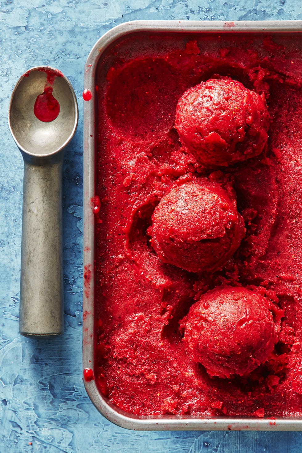 homemade basil berry lemonade sorbet in a metal container