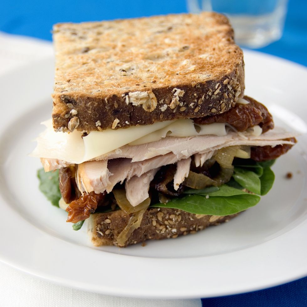 mediterranean diet lunch sandwich on whole grain bread with turkey  tomato and lettuce