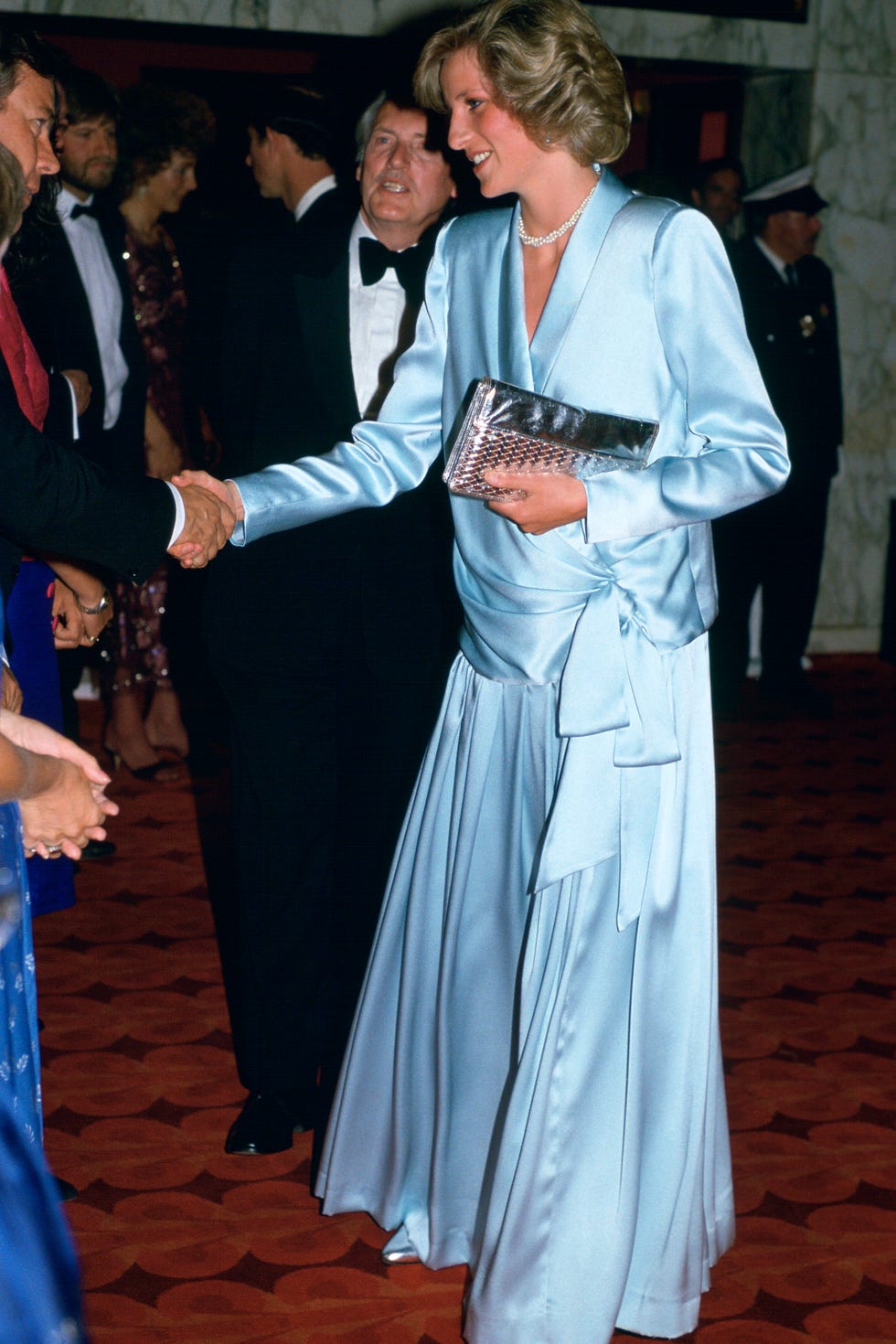 LONDON, UNITED KINGDOM - JUNE 11:  Diana, Princess Of Wales,  Pregnant With Her Second Son, Prince Harry,  Attending The Film Premiere Of 'Indiana Jones And The Temple of Doom' In Leicester Square Just Weeks Before His Birth. She is wearing a pale blue Catherine Walker gown. (Photo by Tim Graham/Getty Images)