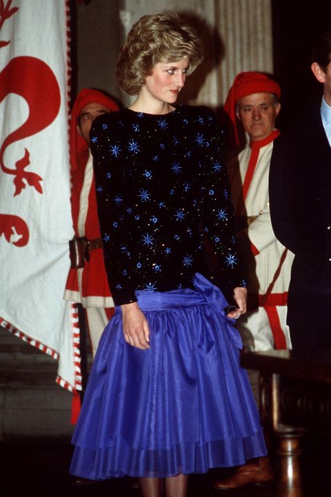 FLORENCE, ITALY - APRIL 23:  Princess Diana During Her Official Tour Offlorence In Italy  Wearing A Blue And Black Knee-length Evening Dress Designed By Jacques Azagury.  The Dress Has A Blue Skirt With A Blue Sash Bow At The Hip.  (Photo by Tim Graham/Getty Images)