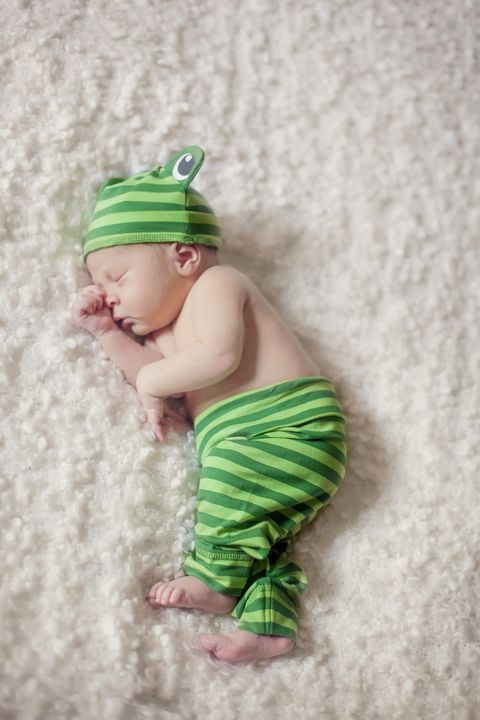 Green, Baby & toddler clothing, Costume accessory, Baby, Costume hat, Abdomen, Stomach, Costume, Baby bloomers, Fictional character, 