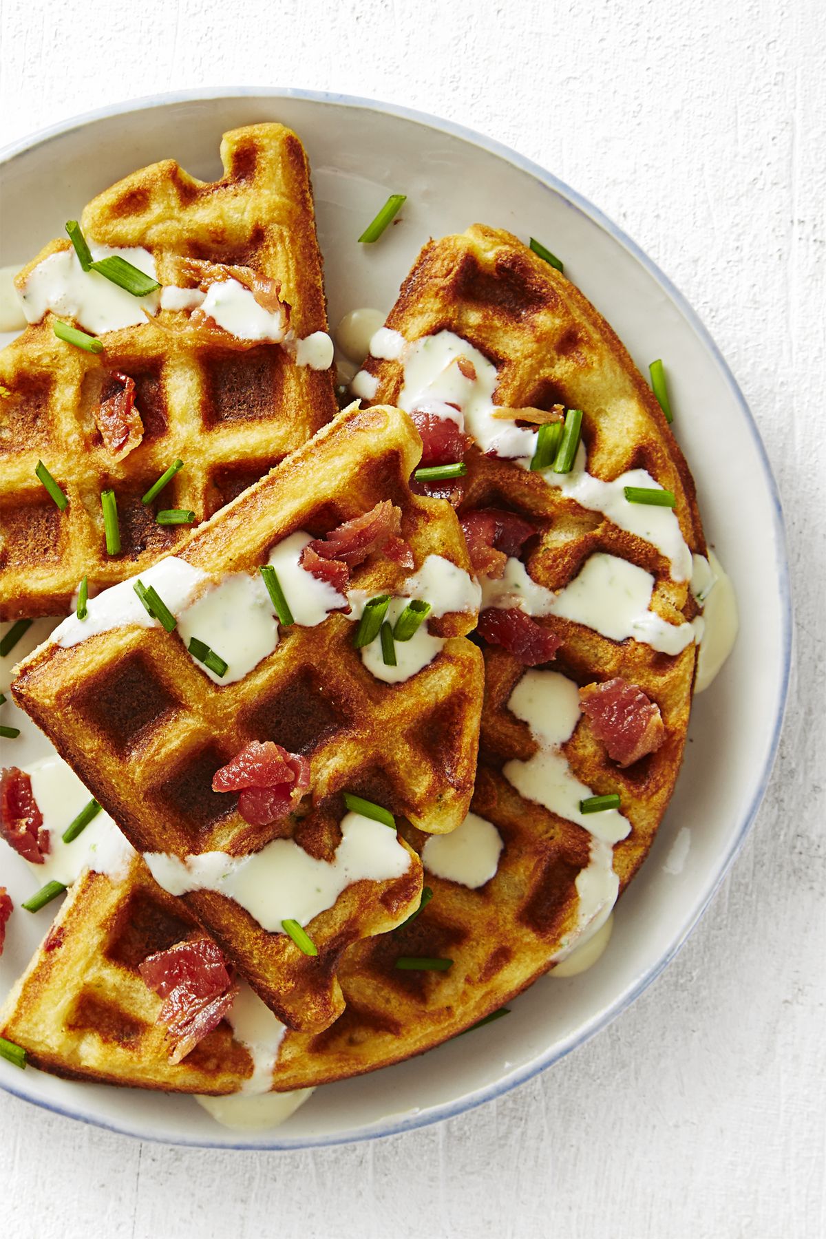  savory bacon and chive waffles on a white plate