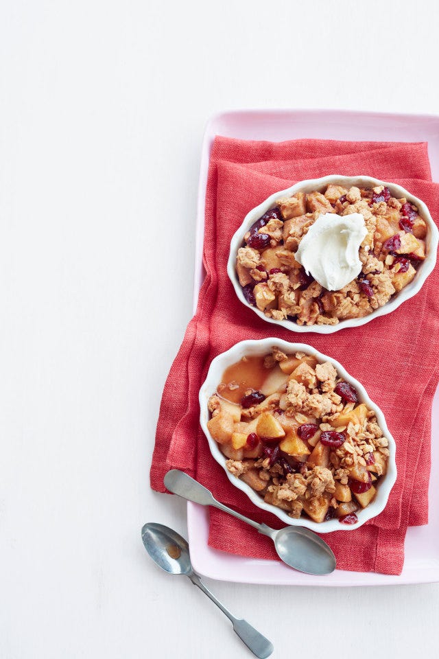 apple pear crisps with peanut butter served in a baking dish