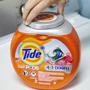 Orange, Logo, Aluminum can, Household supply, Nail, Beverage can, Packaging and labeling, Laundry detergent, Label, Bottle cap, 