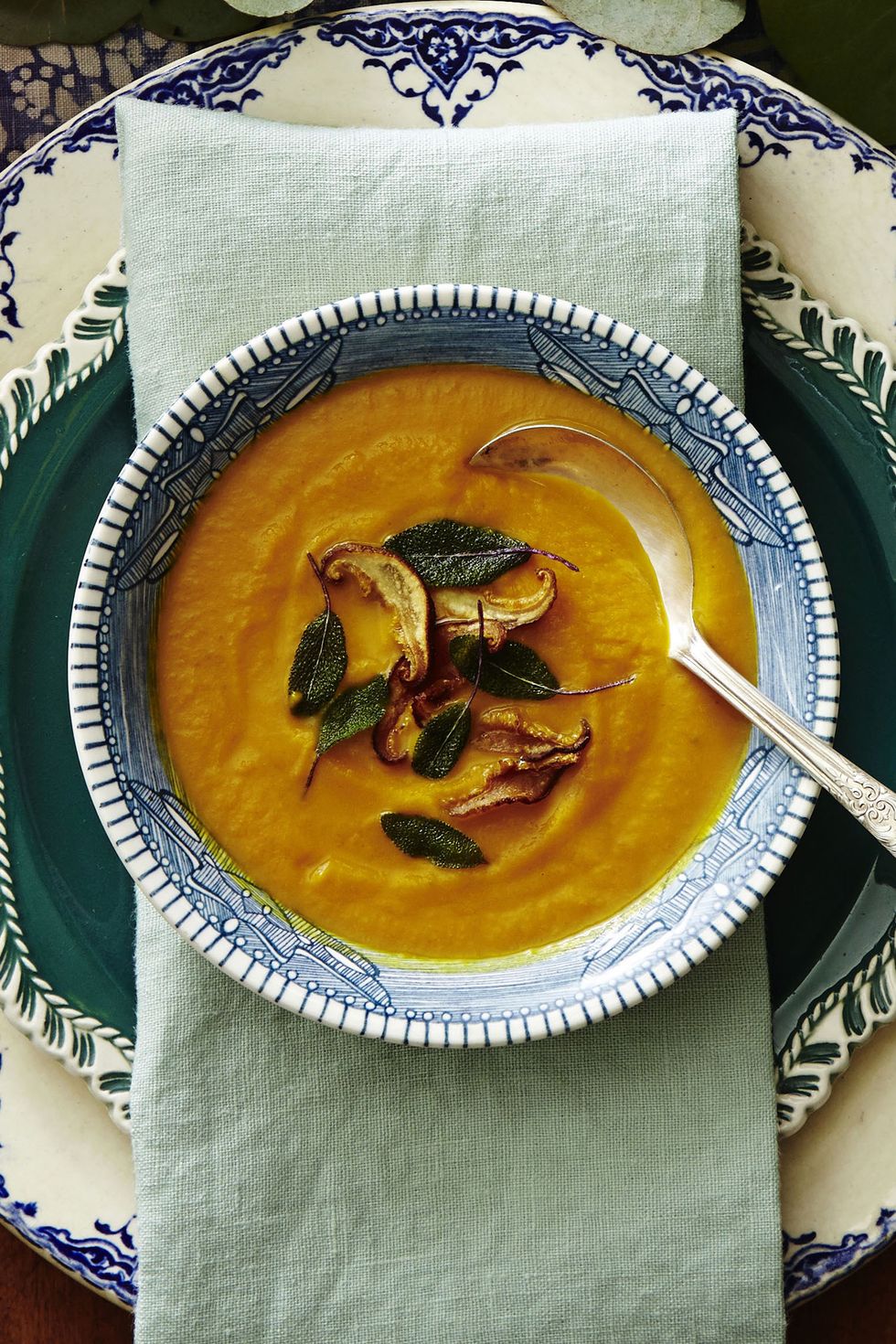 pumpkin and sage soup in a bowl