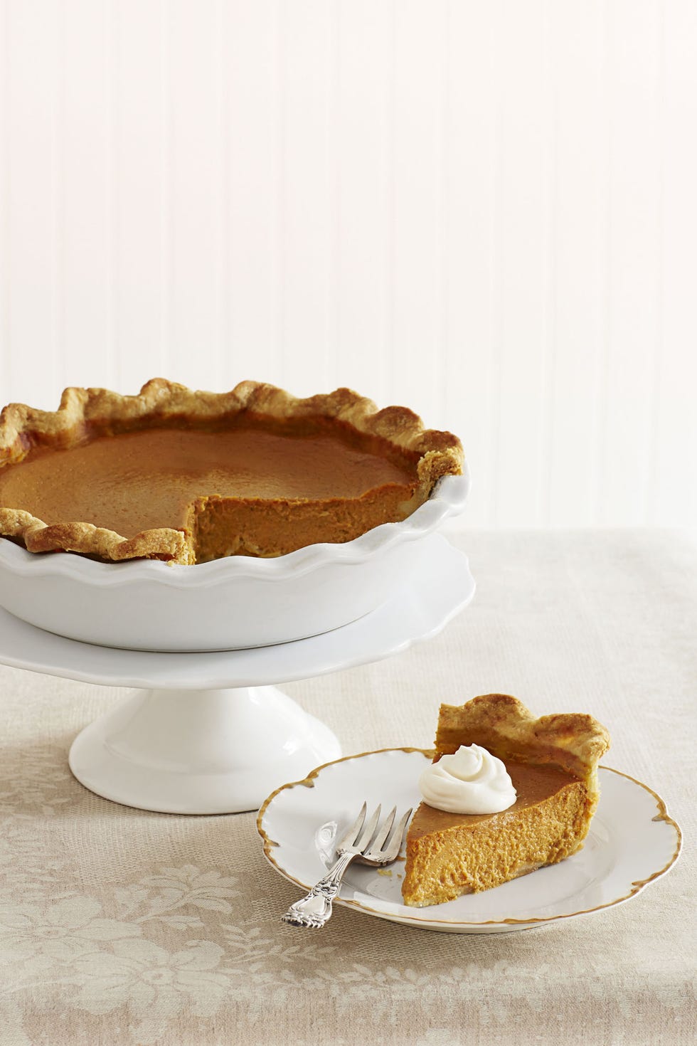 pumpkin pie with rum whipped cream on top