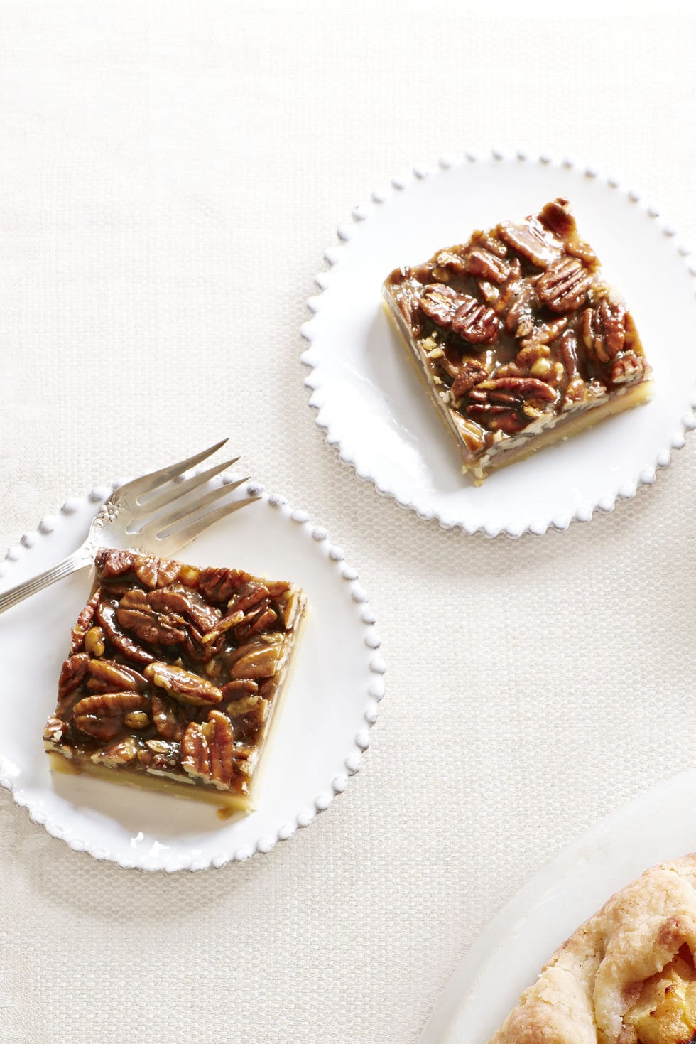 pecan squares on a white plate