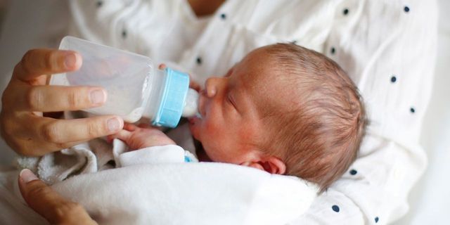 Child, Baby, Skin, Baby bottle feeding, Product, Infant formula, Nose, Birth, Baby bottle, Ear, 