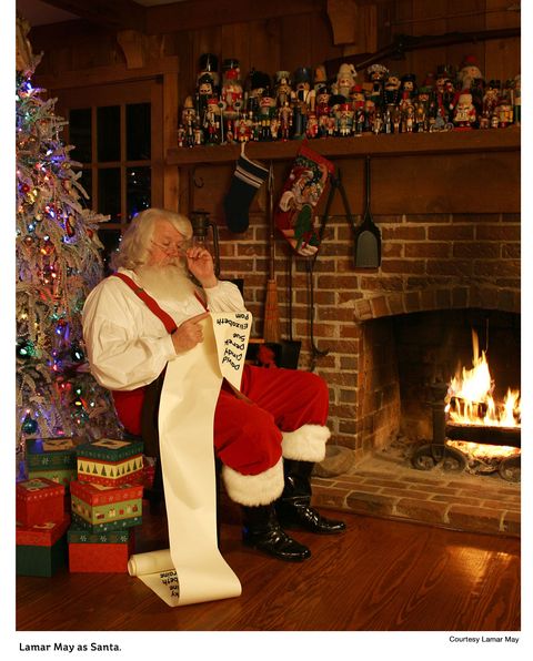 Santa claus, Christmas stocking, Christmas, Christmas eve, Fireplace, Hearth, Fictional character, Holiday, Event, Interior design, 