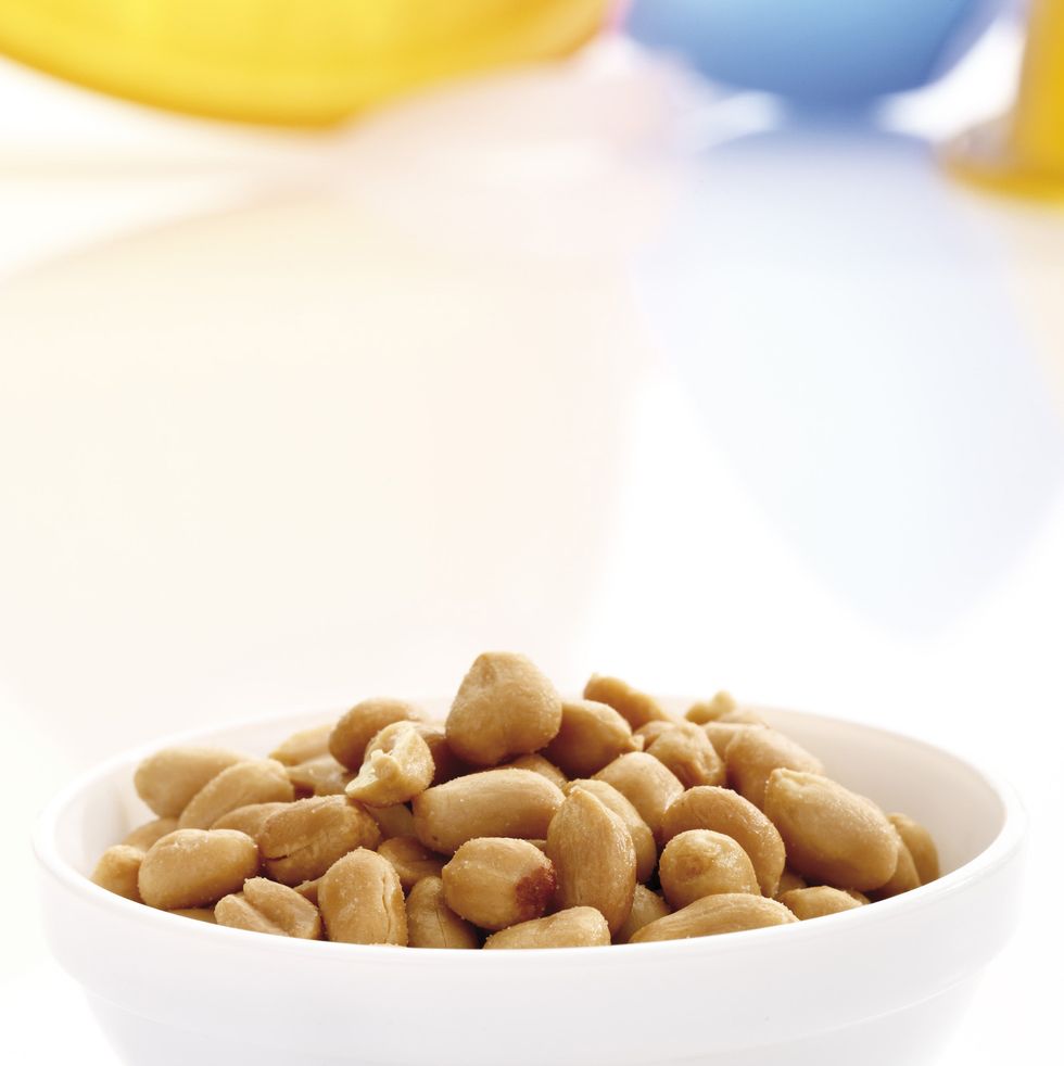 cashews in a white bowl on a white background