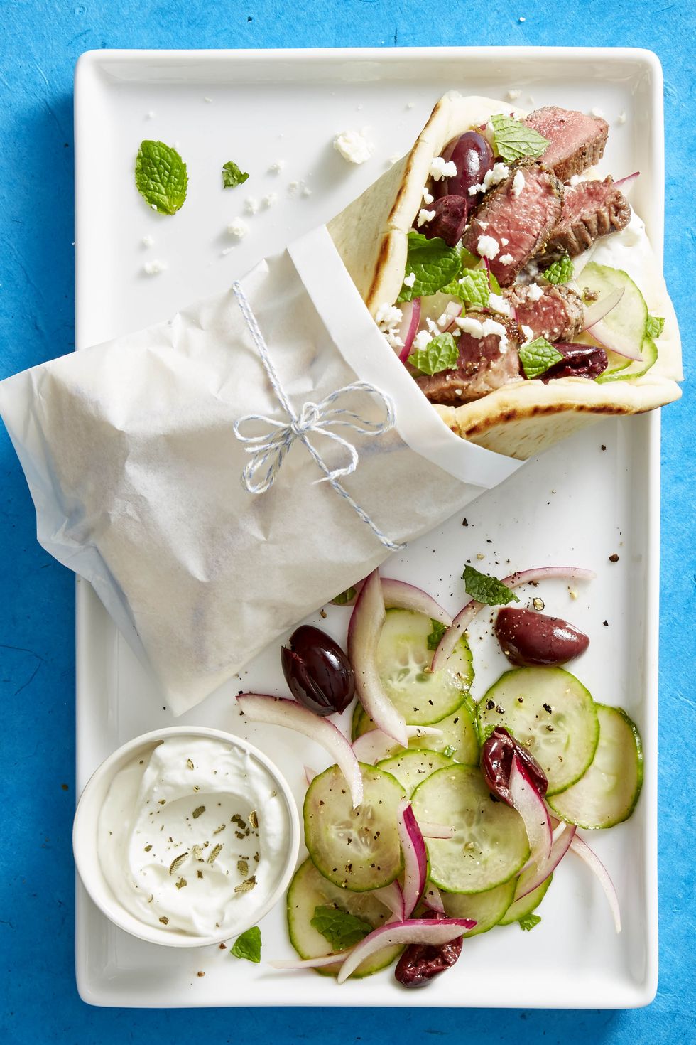 https://hips.hearstapps.com/ghk.h-cdn.co/assets/18/01/1514997324-lamb-souvlaki-cucumber-mint-salad-ghk-0118.jpg?crop=1xw:0.9998571428571429xh;center,top&resize=980:*