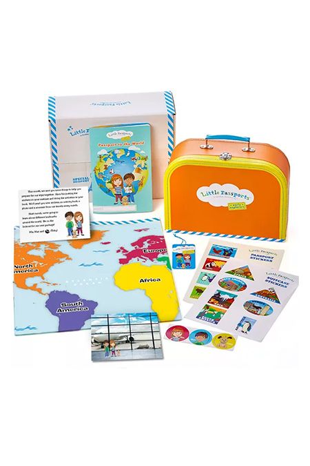 little passports box in shape of suitcase with map stickers, and travel info, good housekeeping pick for best subscription boxes for kids