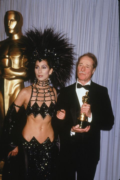 most scandalous oscars moments - cher's feathered outfit, 1986