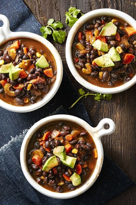 a white bowl of smoky black bean soup