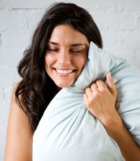 Girl hugging pillow