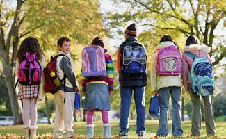 children with backpacks