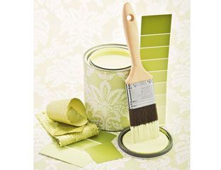 green paintbrush and paint can 