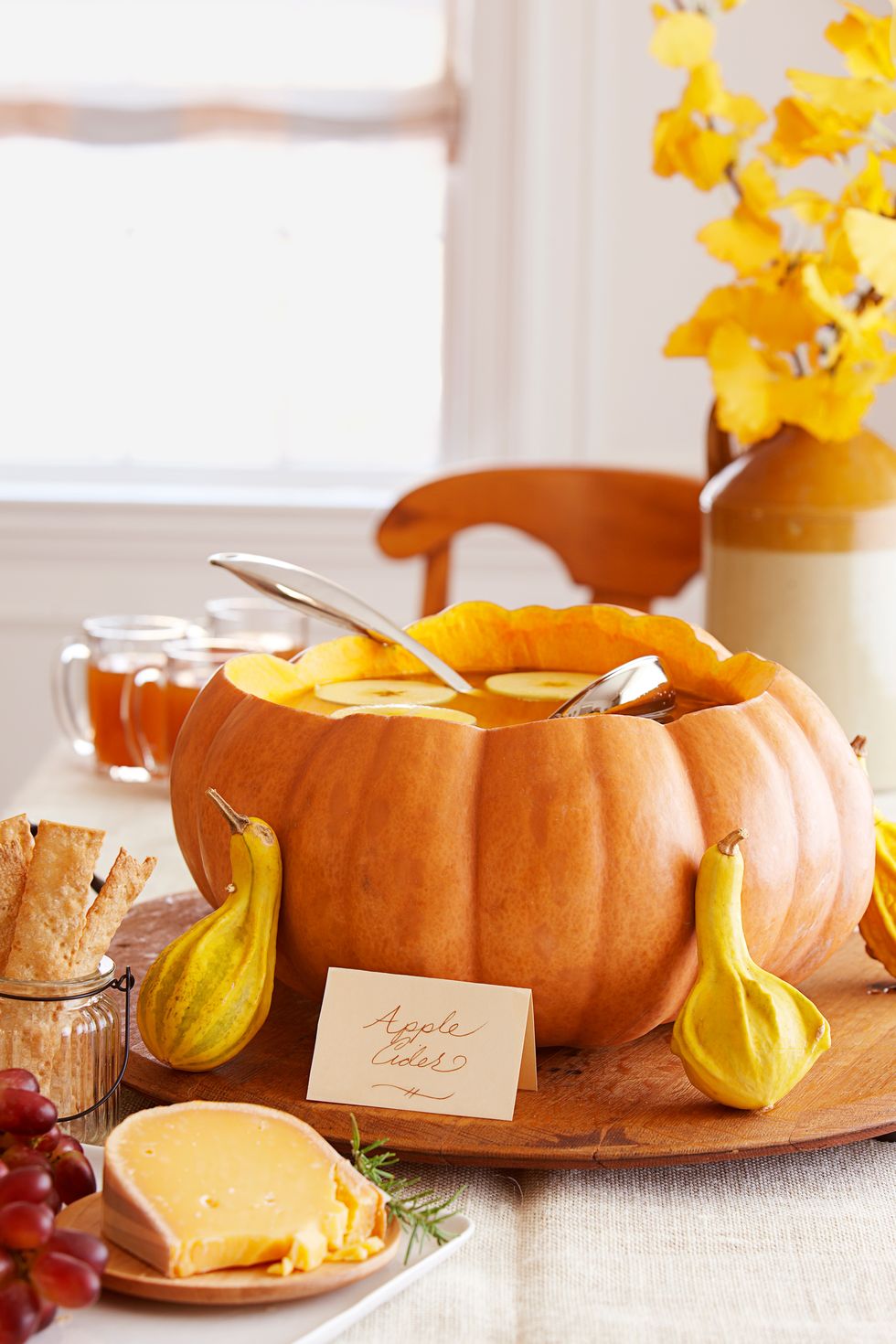 halloween party ideas, pumpkin punch bowl on the table