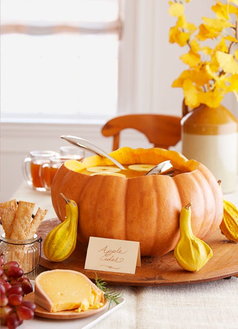 halloween party ideas, pumpkin punch bowl on the table