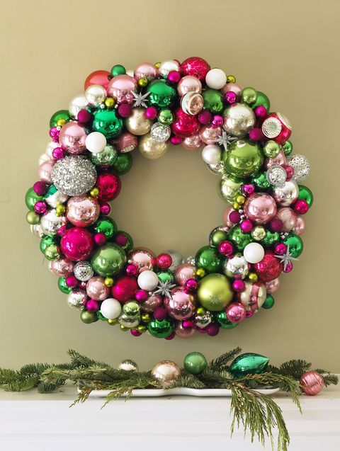 diy christmas wreath, wreath made of ornaments above a mantel