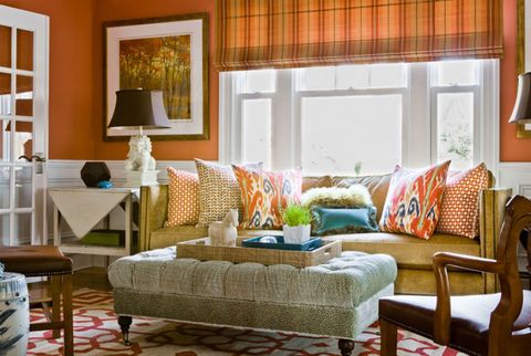 orange living room with patterned pillows