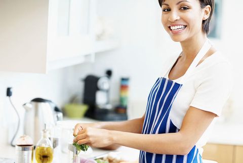 woman in apron cooking