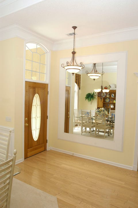What To Do With A Blank Wall Decorate Foyer With Large Mirror