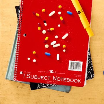 pills on school notebook