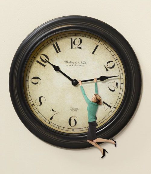 woman hanging onto clock