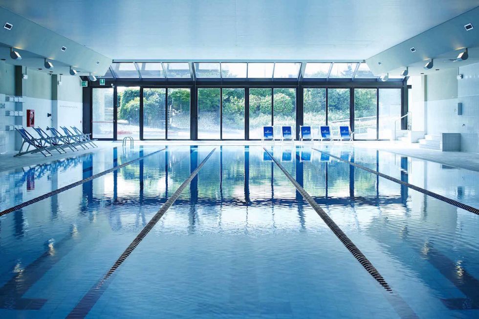 Swimming pool, Blue, Fluid, Aqua, Reflection, Composite material, Leisure centre, Hotel, Transparent material, Swimming, 