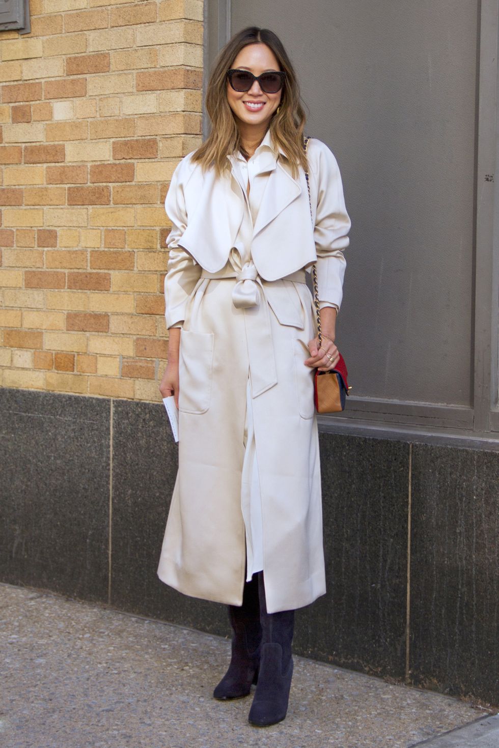 <p>The blogger opts for silken Tibi, belted to allow the coat to be the star of her look. </p>