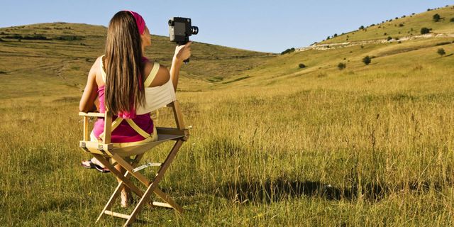 Camera, Cameras & optics, Grassland, Plain, Folding chair, Camera accessory, Field, Digital camera, Film camera, Grass family, 