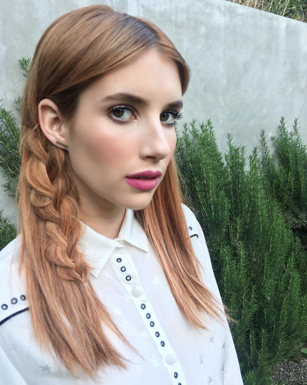 <p>Hairstylist Riawna Capri sneakily worked a statement braid into Emma Robert's strawberry strands for Coachella by taking a chunk of hair, braiding it from the mids-to-ends only, then pancaking it so that it lays flat. Worn tucked behind the ear, it's the perfect way to ensure the plait stays in place—and it just looks cool. </p>