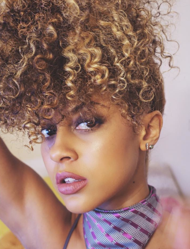 <p>A look we spotted on one of our favorite <a href="http://www.marieclaire.com/beauty/news/g3271/curly-girls-of-instagram/" target="_blank">Curly Girls to Follow on Instagram</a>, <a href="https://instagram.com/bwatuwant/?hl=en" target="_blank">Miss Britt</a> piled on her signature honey-hued ringlets on top of her head in humidity-friendly fashion. The style is also a nighttime technique called "<a href="http://www.essence.com/2013/01/10/ask-curlynikki-what-pineappling-and-how-does-it-affect-my-hair" target="_blank">pineappling</a>," which keeps curls in tact while you sleep.</p>
