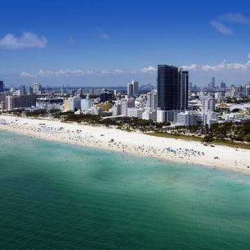 Body of water, Coastal and oceanic landforms, Blue, Daytime, Coast, Natural environment, Shore, Condominium, Tower block, Ocean, 