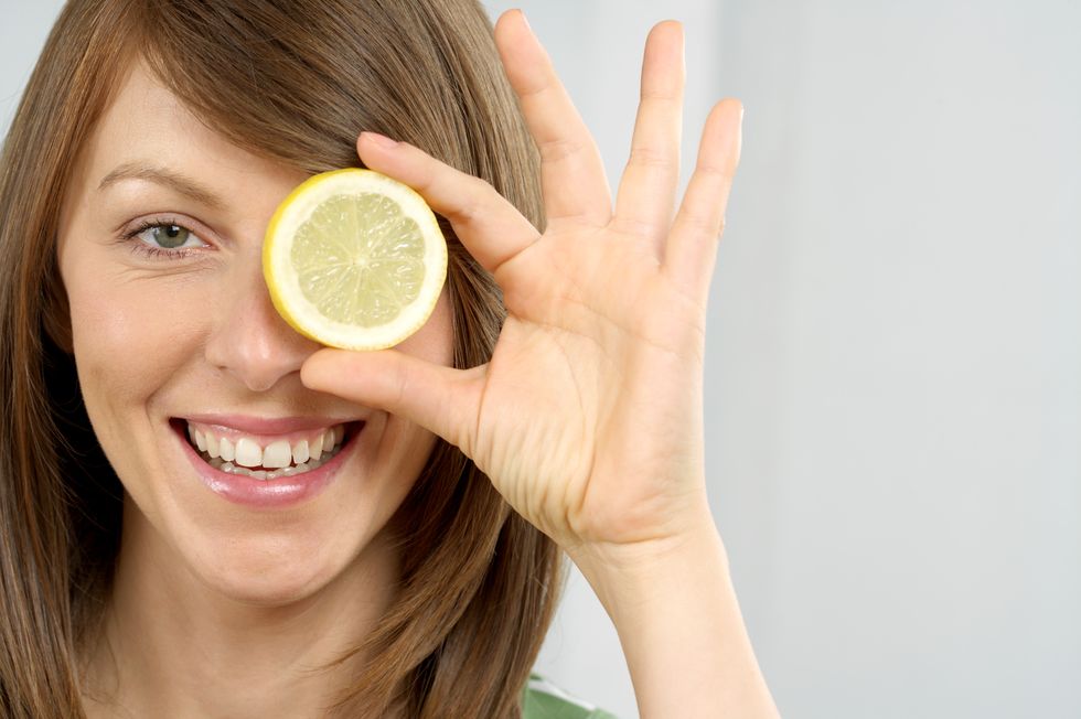 Finger, Skin, Fruit, Citrus, Happy, Facial expression, People in nature, Sharing, Wrist, Tooth, 