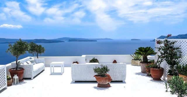 Flowerpot, Coastal and oceanic landforms, Ocean, Azure, Outdoor furniture, Sea, Houseplant, Resort, Tropics, Balcony, 