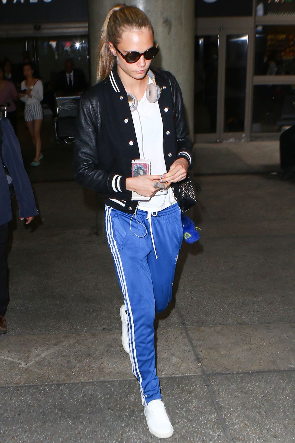<p>Cara Delevingne can rock a sexy red carpet look with the best of them, but her default is sporty looks that leverage varsity jackets and track pants to very cool places. </p>