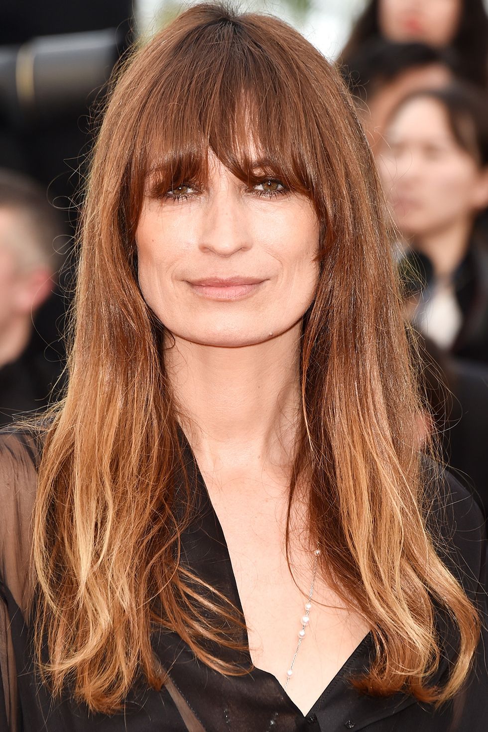 <p>The French beauty pairs well-done balayage with her signature undone texture.</p>