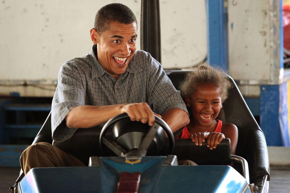 <p>Playing bumper cars with Sasha in Des Moines, Iowa in 2007</p>