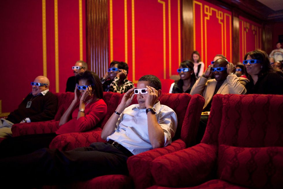 <p>Watching the Super Bowl in the White House theater in 2009</p>