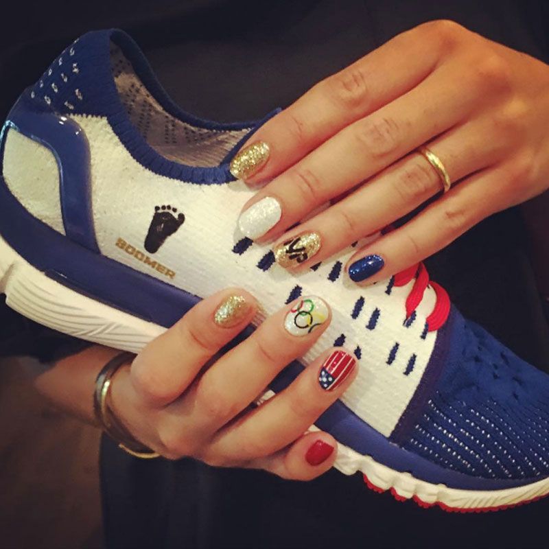 <p>Michael Phelps' fiancé posted this snap on <a href="https://www.instagram.com/p/BIu785UA0cL/?taken-by=nicole.m.johnson&hl=en">Instagram</a>, thanking her manicurist, Nina, for her fly tips. (Look closely and you'll see flags, Olympic rings, and her future hubby's initials.)</p>