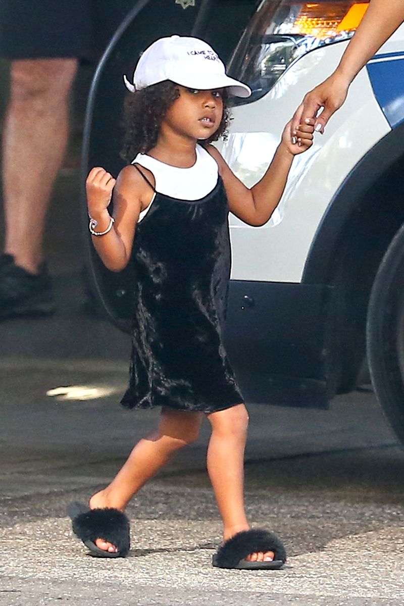 <p>North West takes note from her mom in a mini velvet slip dress.</p>