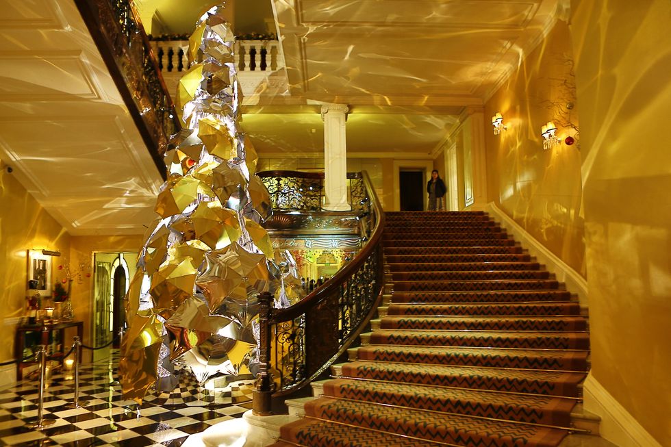 Stairs, Yellow, Interior design, Ceiling, Amber, Light fixture, Hall, Interior design, Handrail, Lobby, 