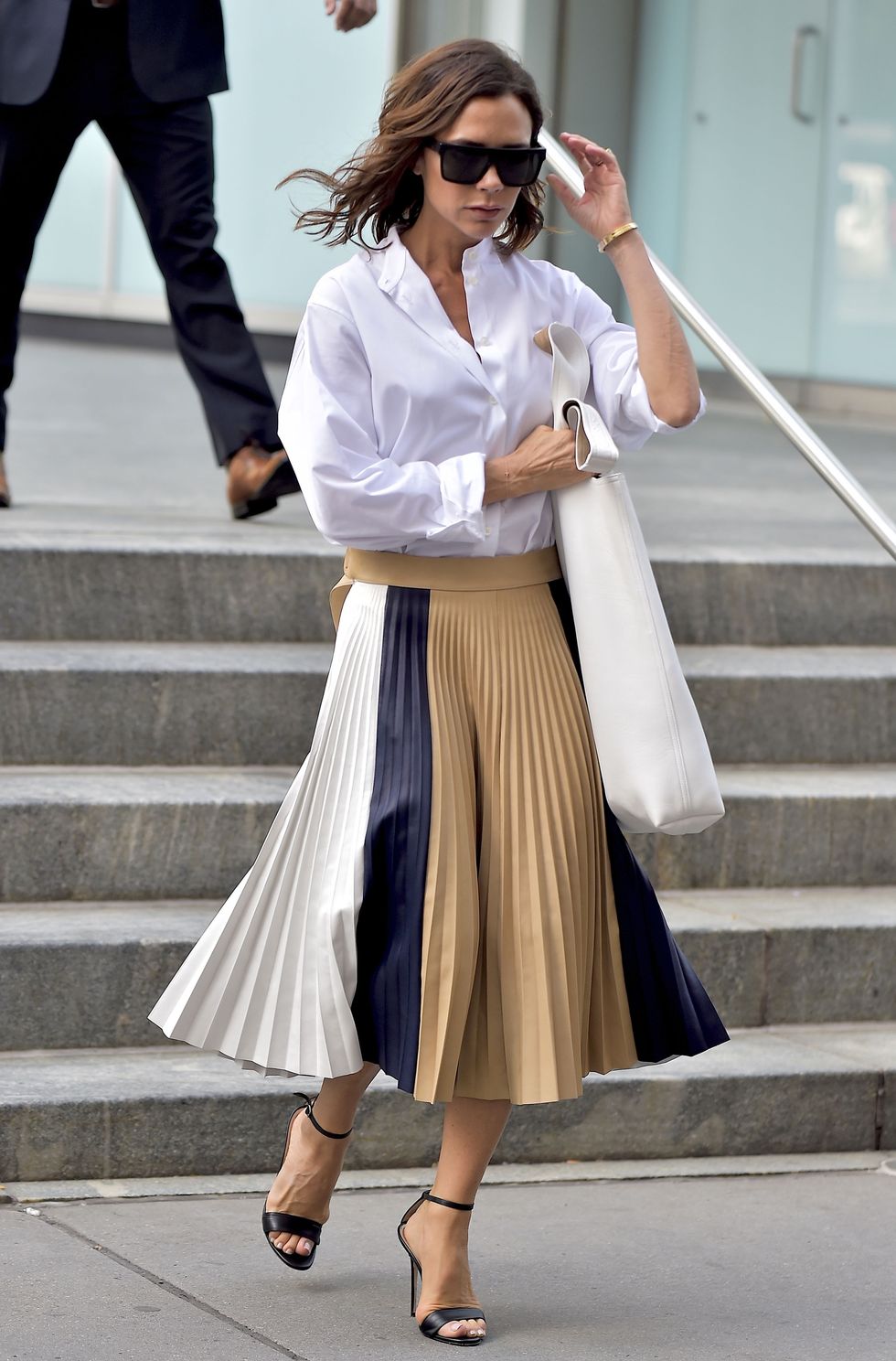 <p> Beckham loves herself a midi skirt, whether worn with a shirt as pictured here, or a silky camisole. While it's easy to write the midi-length off as a little dowdy, they're actually an easy fast-track to autumn/winter 2016 chic. </p>