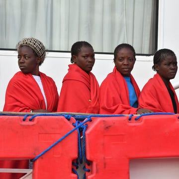 Red, Community, Team, Curtain, Maroon, Crew, Coquelicot, Tradition, Place of worship, Workwear, 